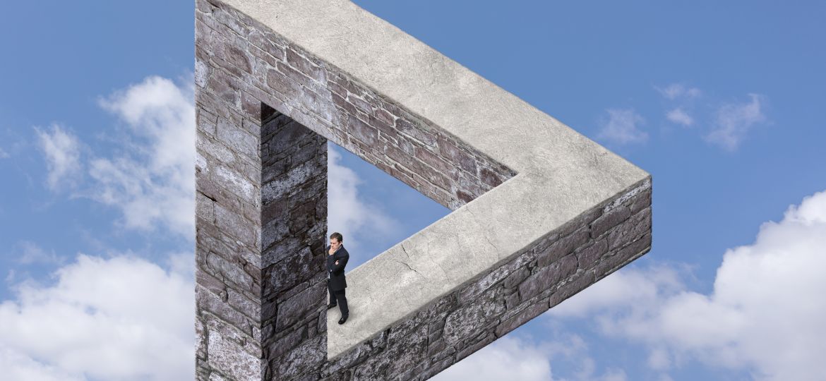 Businessmen on the Impossible Triangle Made with Stone
